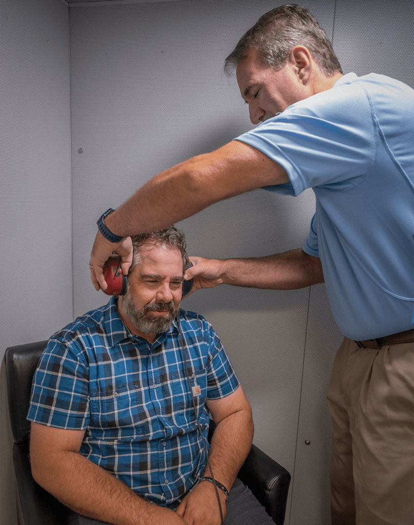 Dr Garrett testing patient hearing