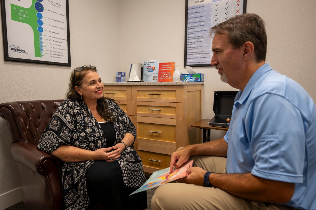 Dr. Layne Garrett, Au.D., conducting comprehensive hearing evaluation with patient at Timpanogos Hearing & Tinnitus in Utah